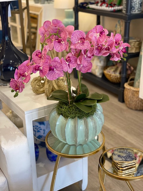 Large green urchin with pink orchids